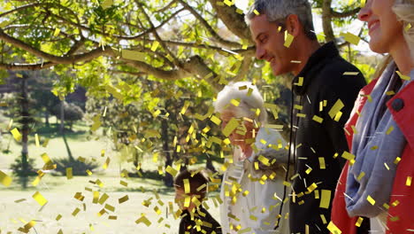 walking outdoors under tree, family enjoying confetti animation