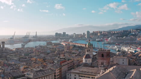 aerial riser in heart of genoa, view over historic buildings toward porto antico