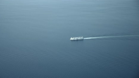 aerial view of luxury cruise ship sailing in the fjord with calm waters