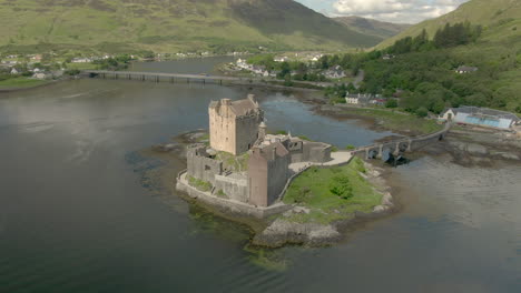 an aerial view of eilean donan castle on a sunny day