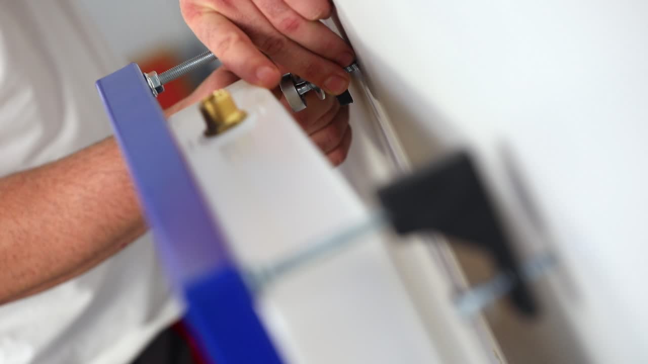 the worker who repairs and installs the toilet bowl and flush uses tools such as pliers and spanners