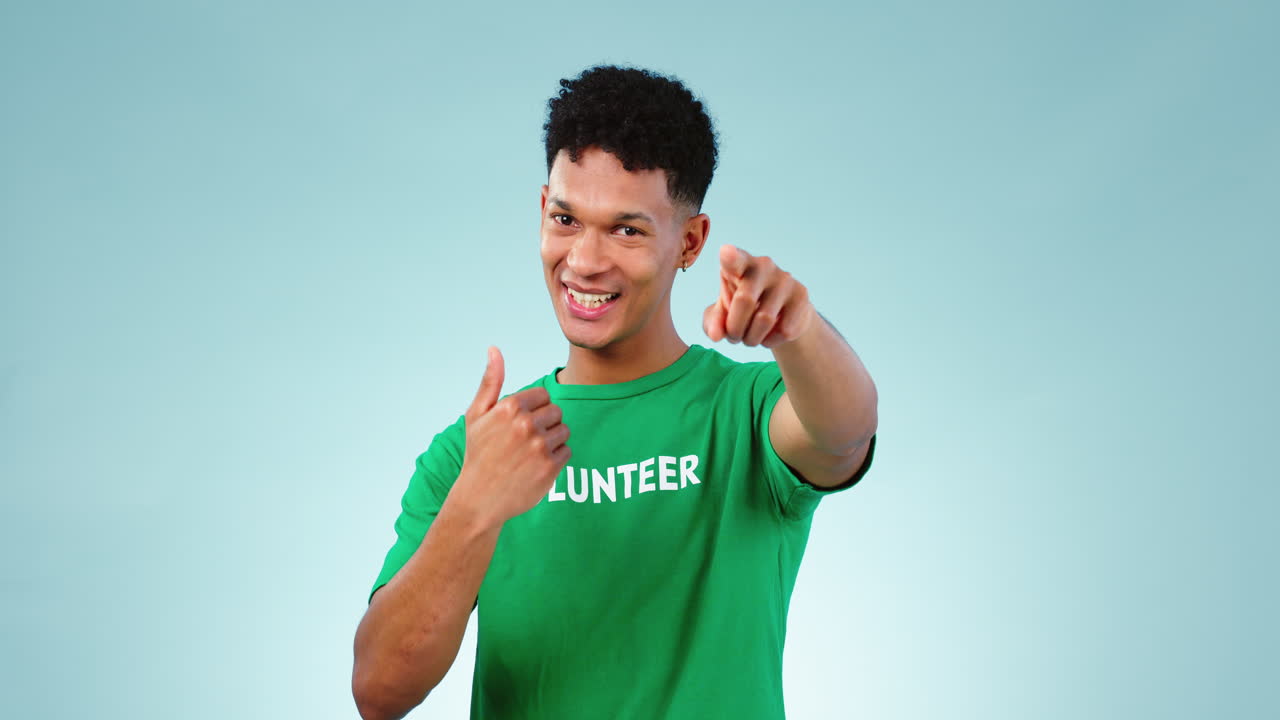 Volunteer man, studio and point at you