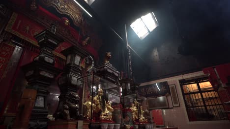 Tracking-in-Beautiful-Chinese-temple-interior,-Natural-light-comes-from-the-ceiling-window,-Kuala-Lumpur