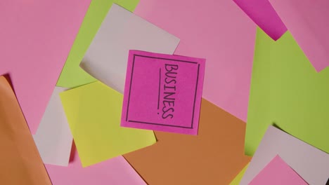 Business-Concept-Of-Revolving-Sticky-Notes-With-Business-Written-On-Top-Note