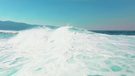 surfer surfing big wave barrel tube slow motion on australian coast aerial video