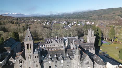 drone flies above beautiful castle in scotland