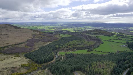 view from the comeragh mountains of the lush farmland of waterford and the sea beyond spring morning