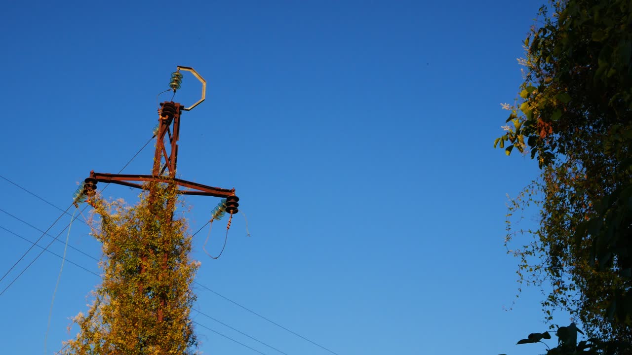 An old and rusted power tower