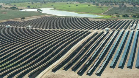 Solar-panel-installations-near-a-lake-and-agricultural-landscape