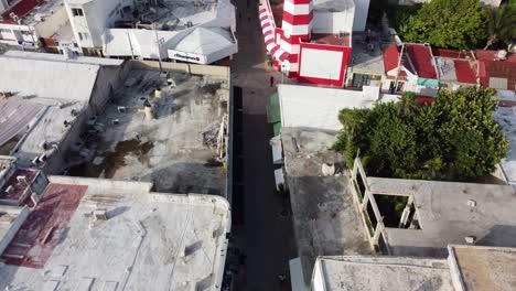 An-aerial-shot-of-a-narrow-street-on-the-shore-of-an-Ocean