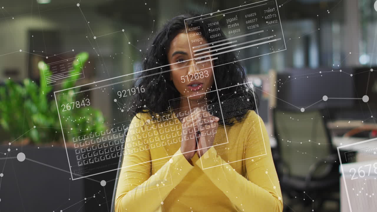 Animation of financial data processing over biracial businesswoman