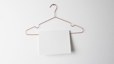 Video-of-book-on-hanger-with-white-blank-pages-and-copy-space-on-white-background