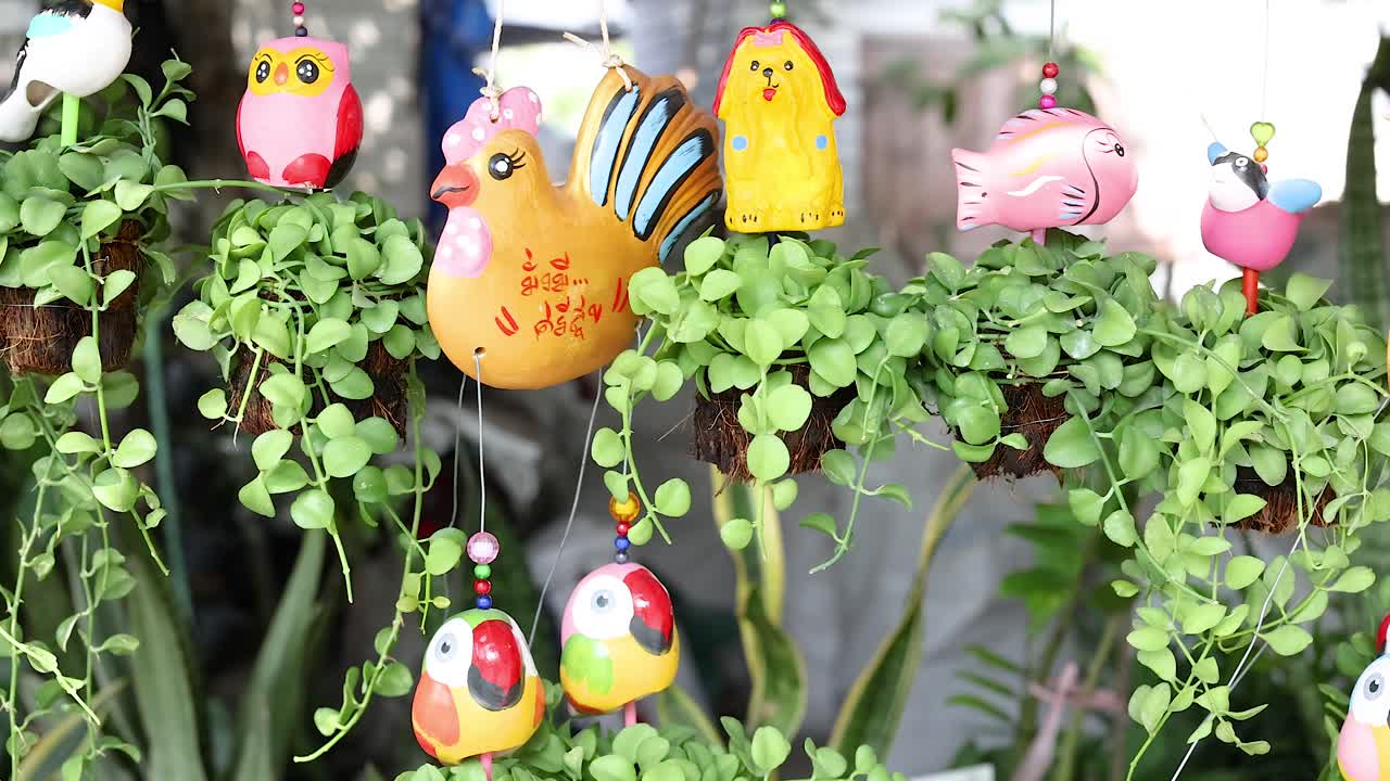 Vibrant sculptures amidst lush greenery in Bangkok