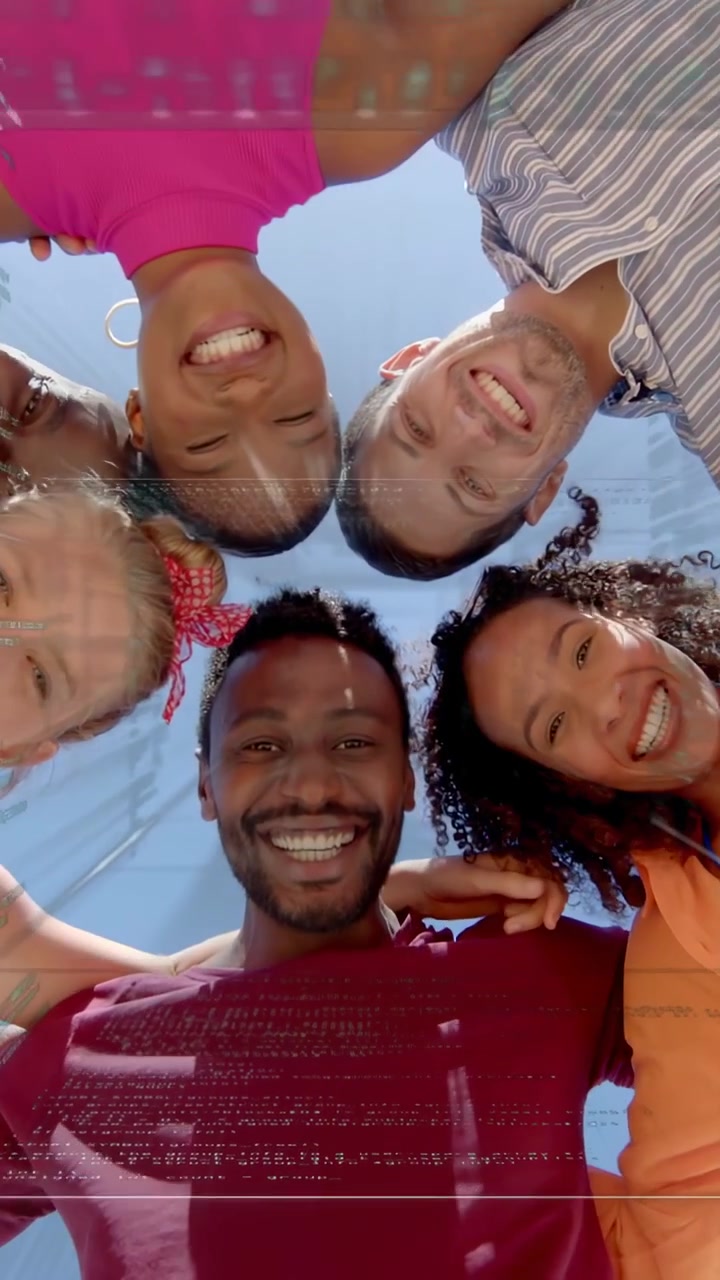 Vertical video: Six friends moving to cam leaning in hugging smiling under glass roof glare for ads