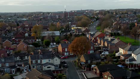 rainhill typical british suburban village in merseyside, england aerial view descending over autumn residential council neighbourhood