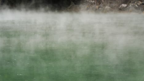 thermal valley hot spring lake smoky surface rain water ripple in beitou, taiwan taipei