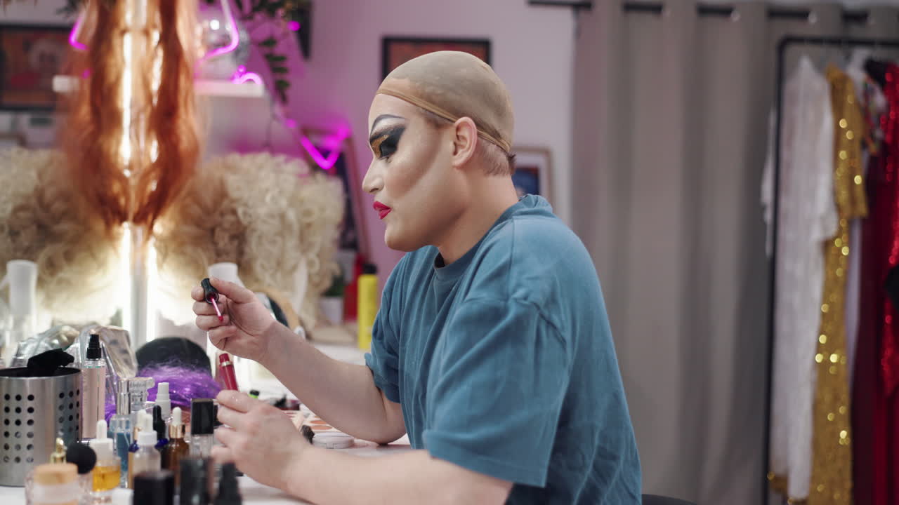 Drag queen applying makeup