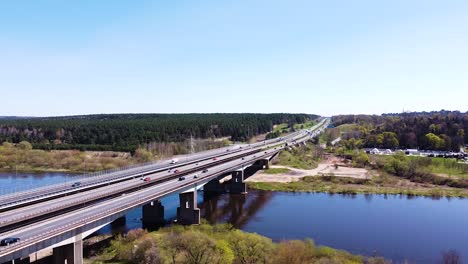 three highway bridges over river neris in kaunas city, aerial low angle view