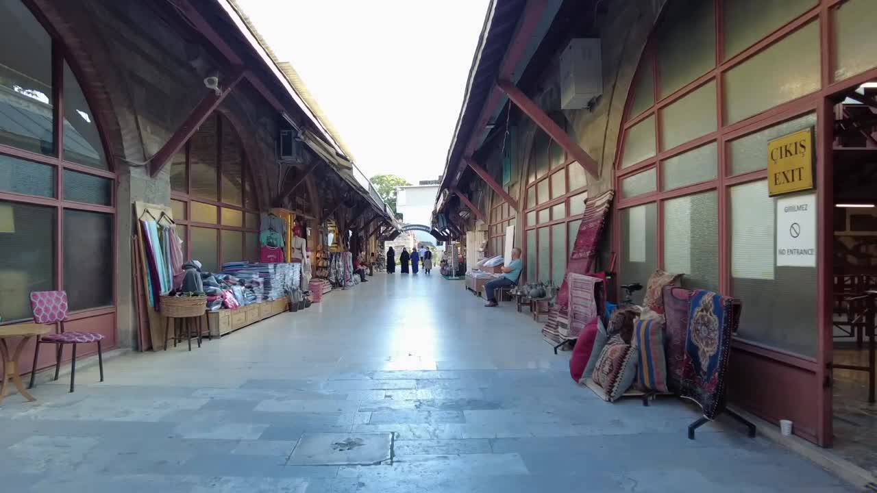 Walking through the Arasta Bazaar market in Istanbul, Turkey, a vibrant marketplace with traditional crafts, textiles, and souvenirs, offering an authentic shopping experience amidst cultural heritage