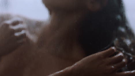 beautiful woman taking shower touching wet skin enjoying luxury spa cleansing smooth complexion