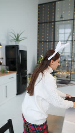 Woman Setting a Festive Christmas Dinner Table