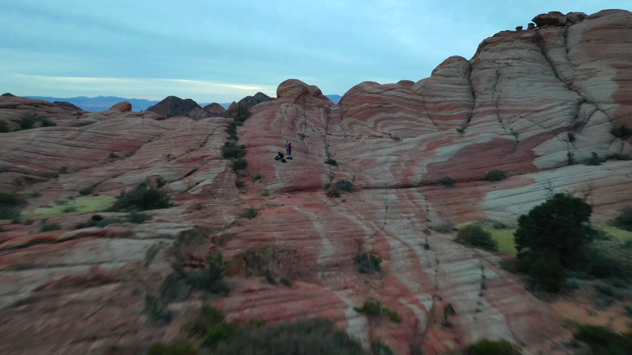 Aerial View of Hikers in Red Rock Desert Landscape