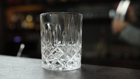 empty cocktail glass at a bar