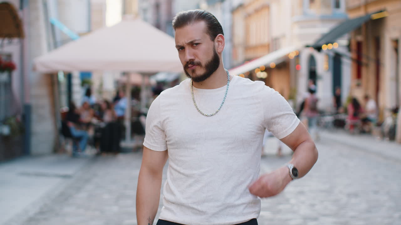 Happy man showing thumbs up like sign positive something good positive feedback in city street