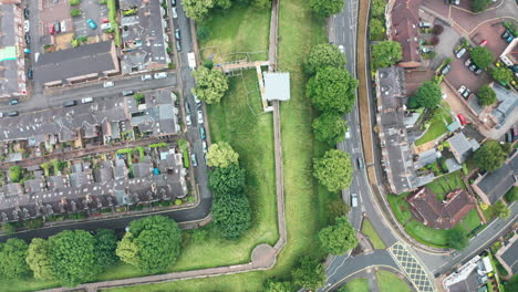 top down drone shot along york city wall under repair