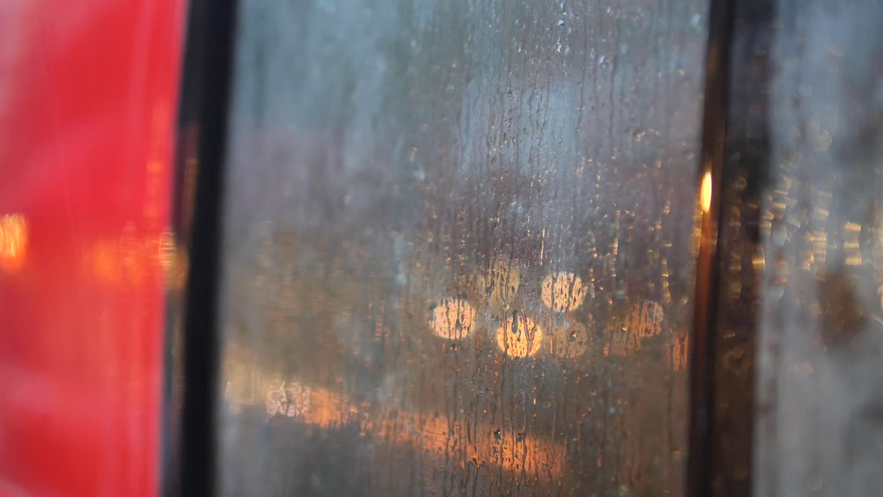 Rainy Night View Through a Car Window