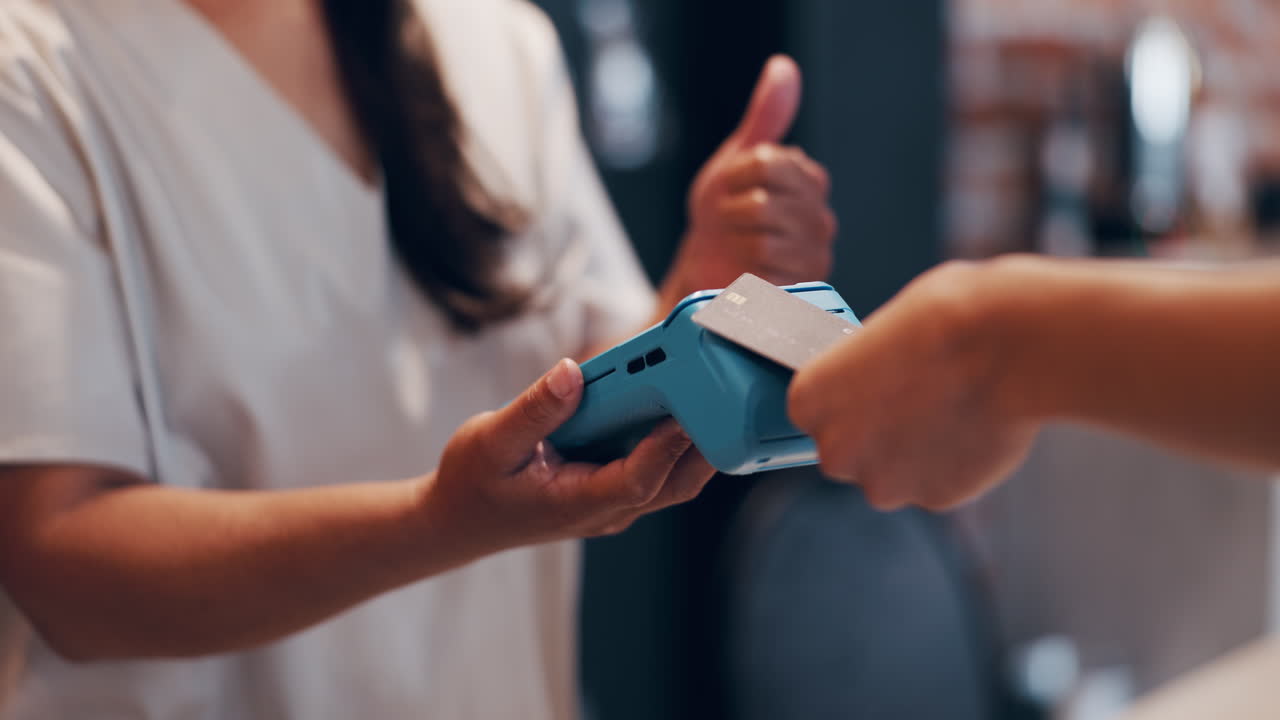 Customer Inserting Credit Card into Payment Terminal for Purchase