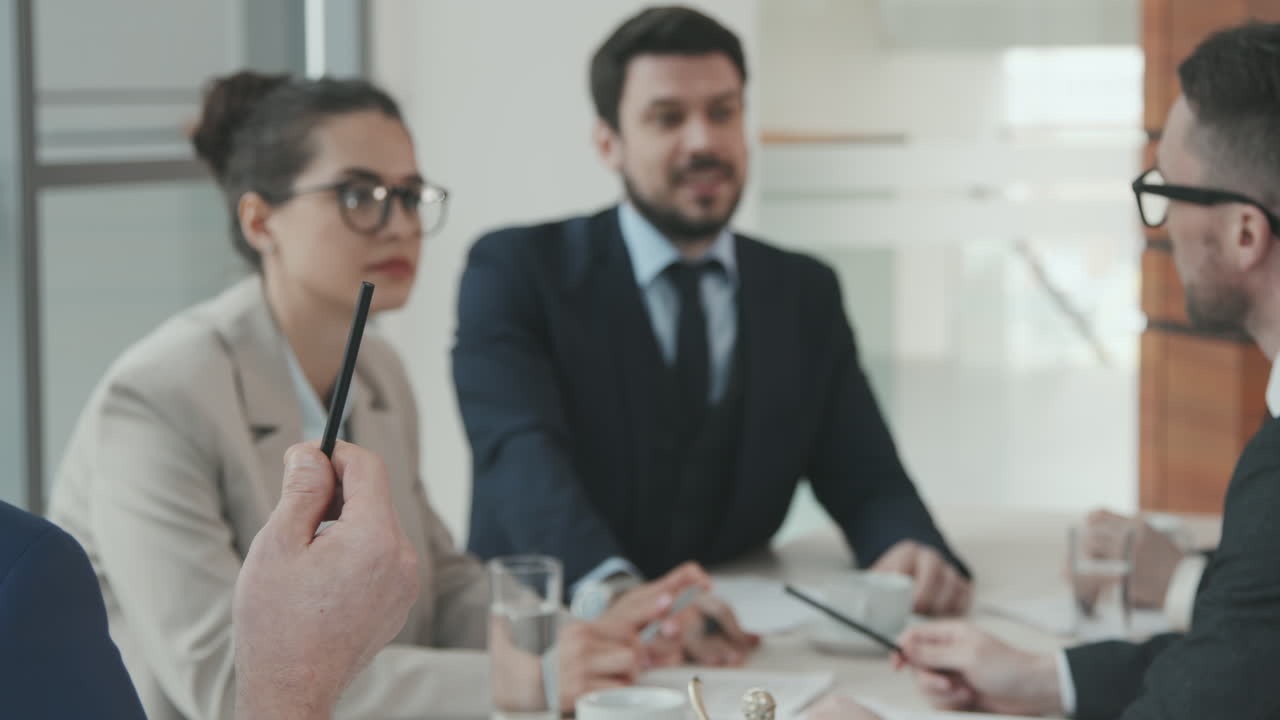 Team of Lawyers Discussing Case at Meeting Table