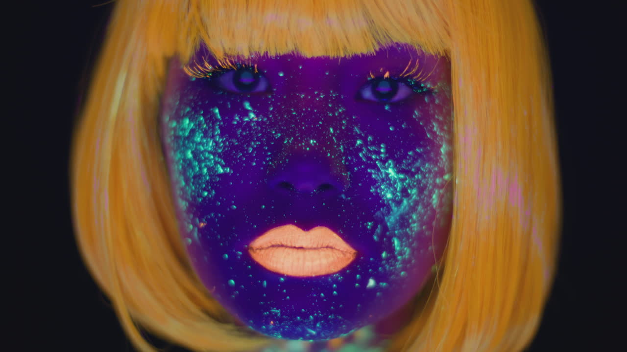 Woman with Neon Face Paint and Yellow Hair