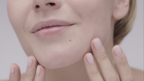 macro close up beautiful healthy woman touching skin slow motion for beauty skincare concept on a grey background