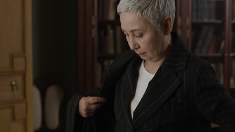 senior woman lawyer getting ready in an office