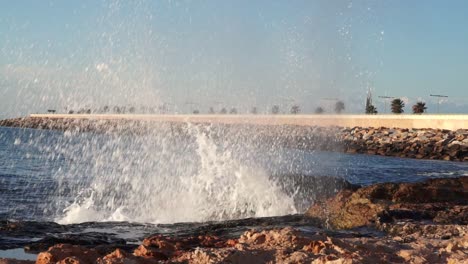 beautiful-waves-splashing-though-the-rocks