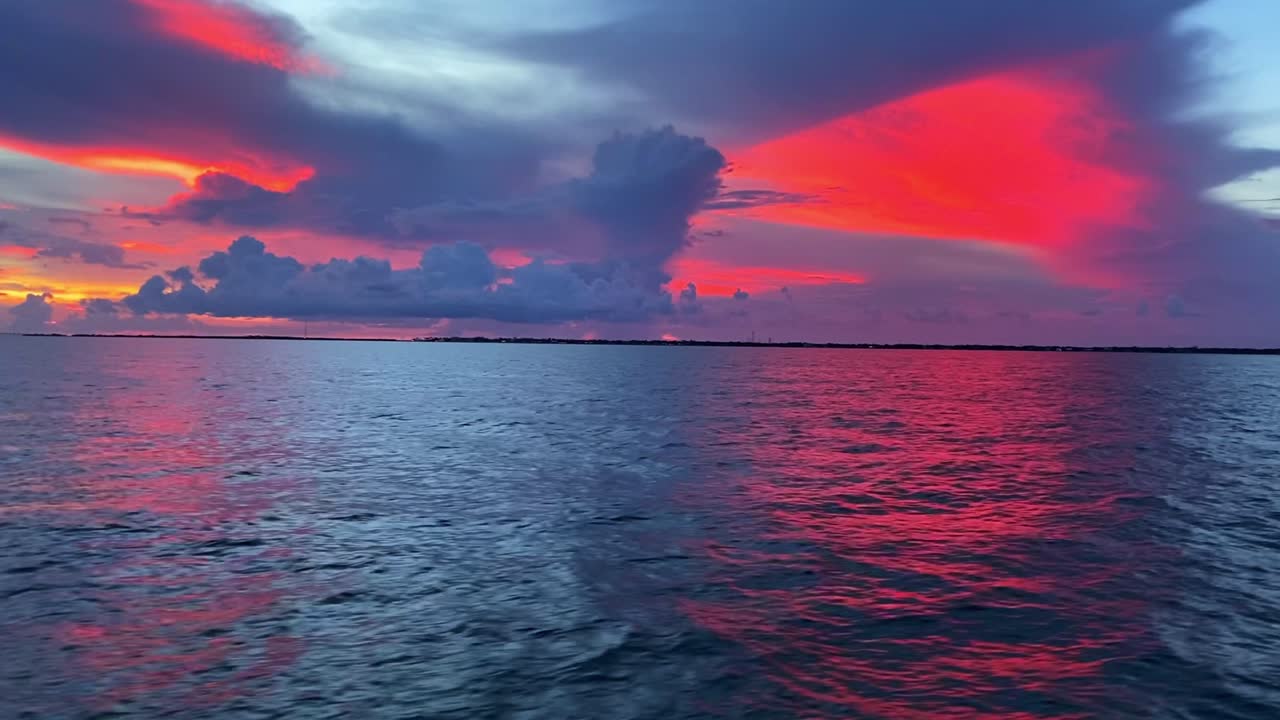 Smooth clip of the sunset and red color of the sky and clouds in Florida Keys, USA