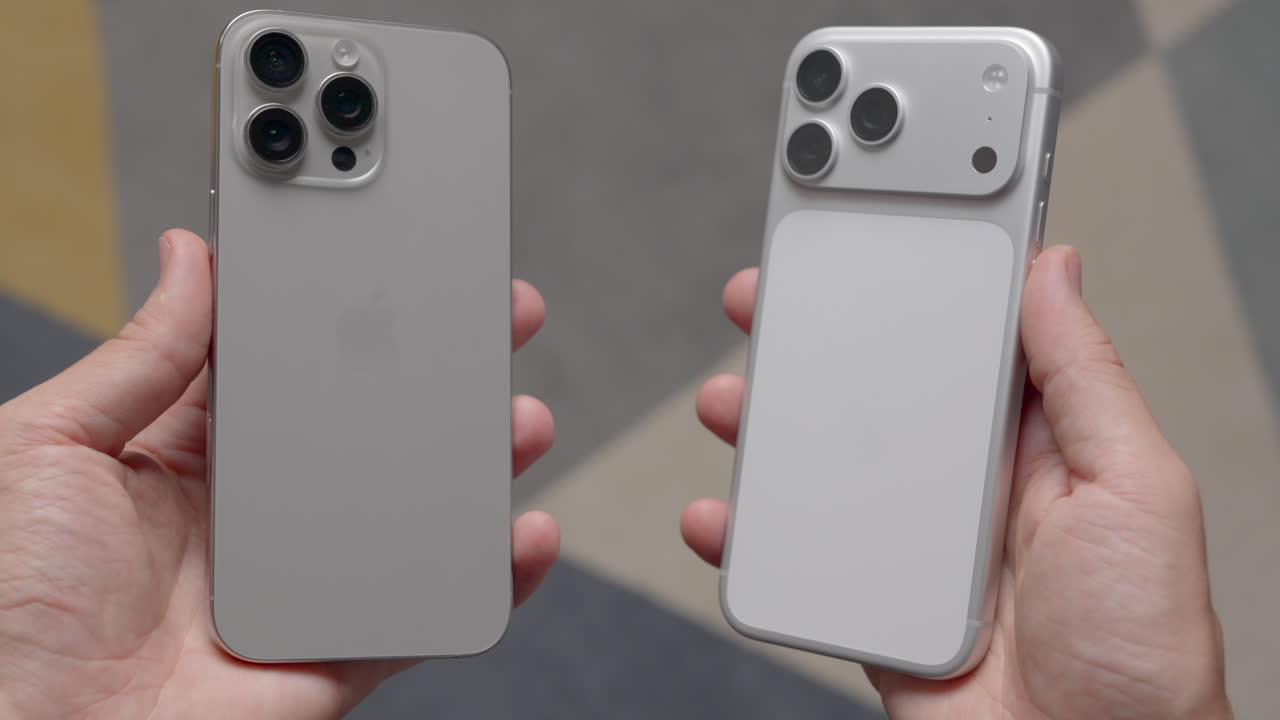 Two iPhones being held