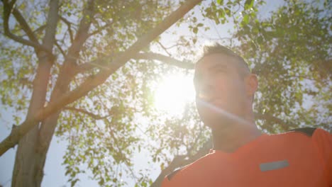 low angle view of male trainer drinking water in the garden of nursing home 4k