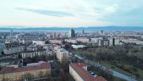 bulgaria skyline buildings and cityscape at sunset under hazy sky due to climate change, drone shot