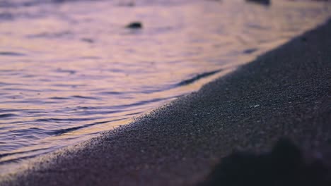 close up ocean waves after sundown on an empty beach