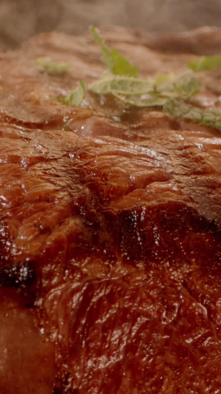 Close-up of cooked meat with mint and herbs