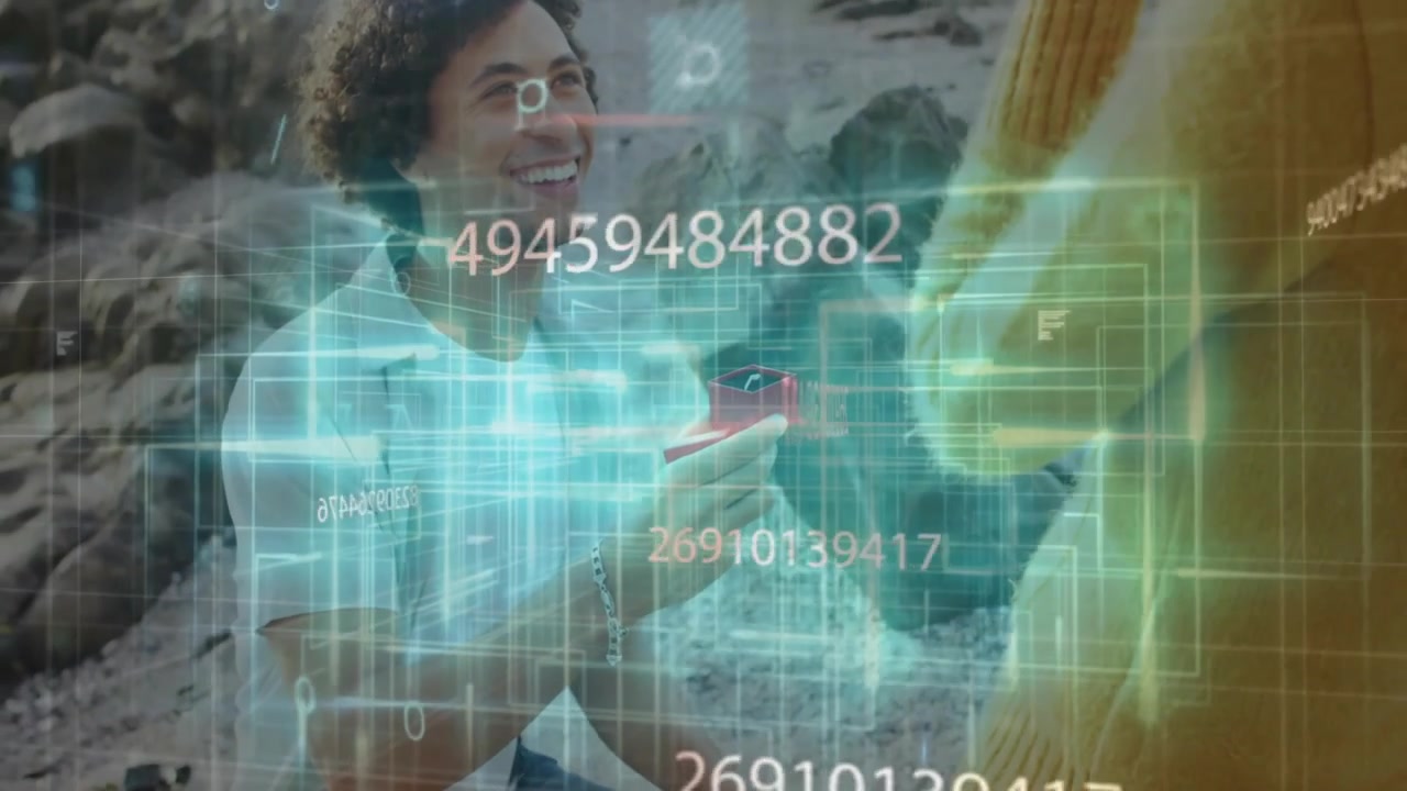 Man kneeling proposing ring on rocky beach, showing floating numbers and grid lines for tech design
