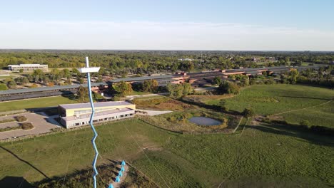 farm buildings and tower in michigan, aerial drone ascend view