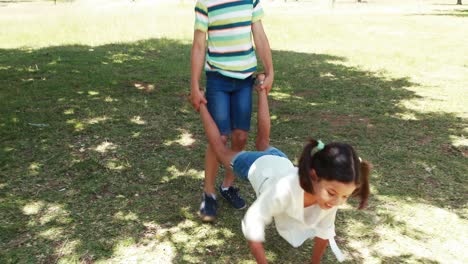 two siblings having fun together in park
