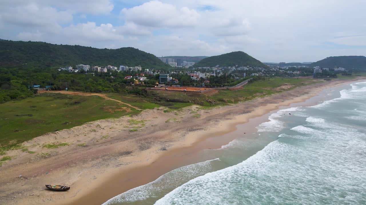Stunning aerial drone shot of Vizag city, showcasing the vibrant cityscape alongside the sparkling ocean waters.