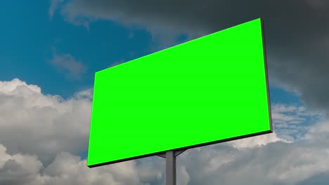 blank green billboard and moving white clouds agains blue sky - timelapse
