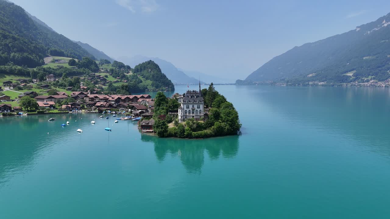 Low panning aerialIselwalt village Switzerland Lake Brienz drone