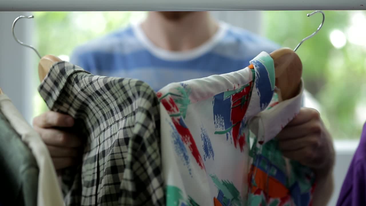 Man Choose Hanged Shirts Apparel Style Options On Closet Garment Rack