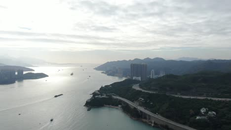 hong kong bay skyline at sunset , high altitude wide aerial shot